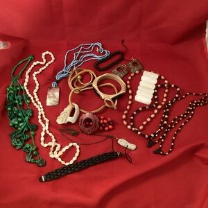 Jewelry lot mostly made of wood, shells, leather materials